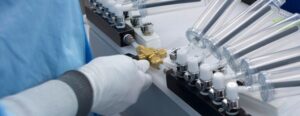 a person holding tubes and valves