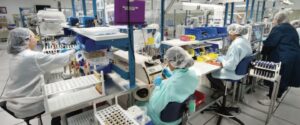 Viant employees at work stations on the manufacturing floor