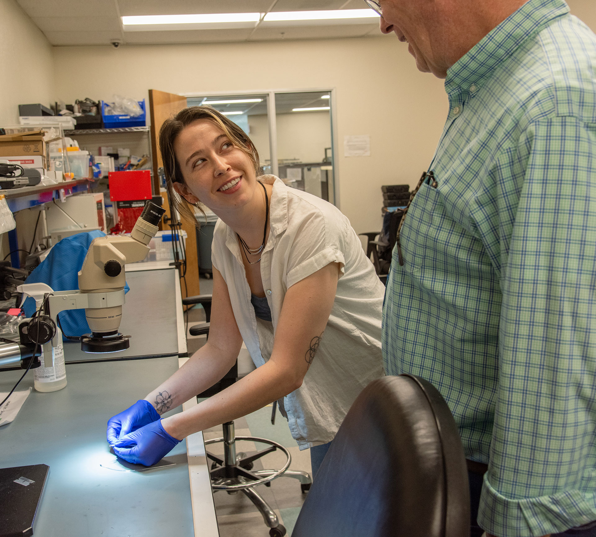 Two Viant employees having a conversation together in a lab