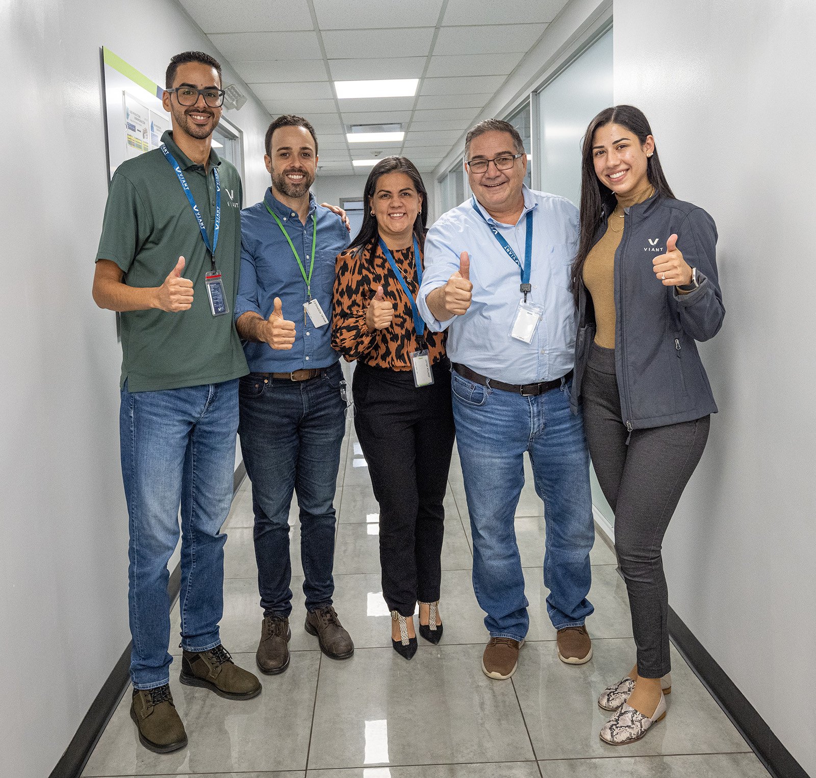 Viant employees standing together in the hallway