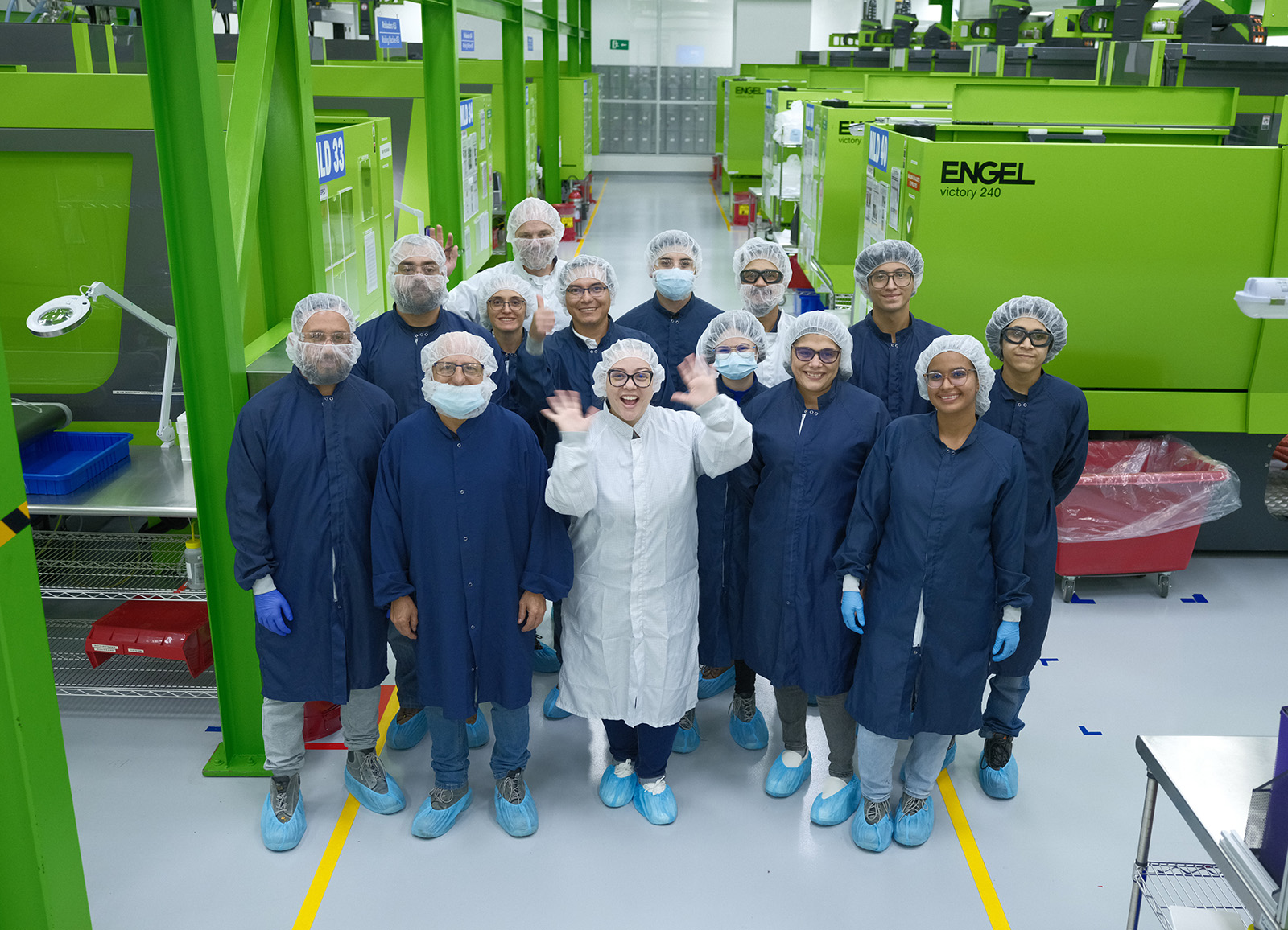 Viant employees standing together on the factory floor