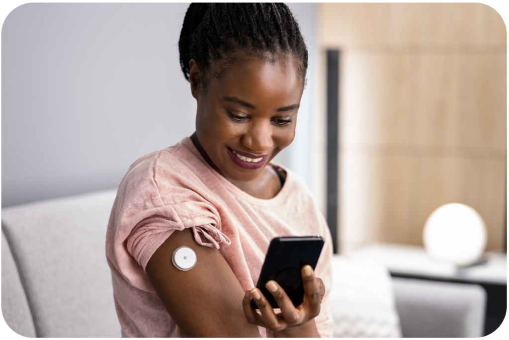 a woman holding and looking at her phone