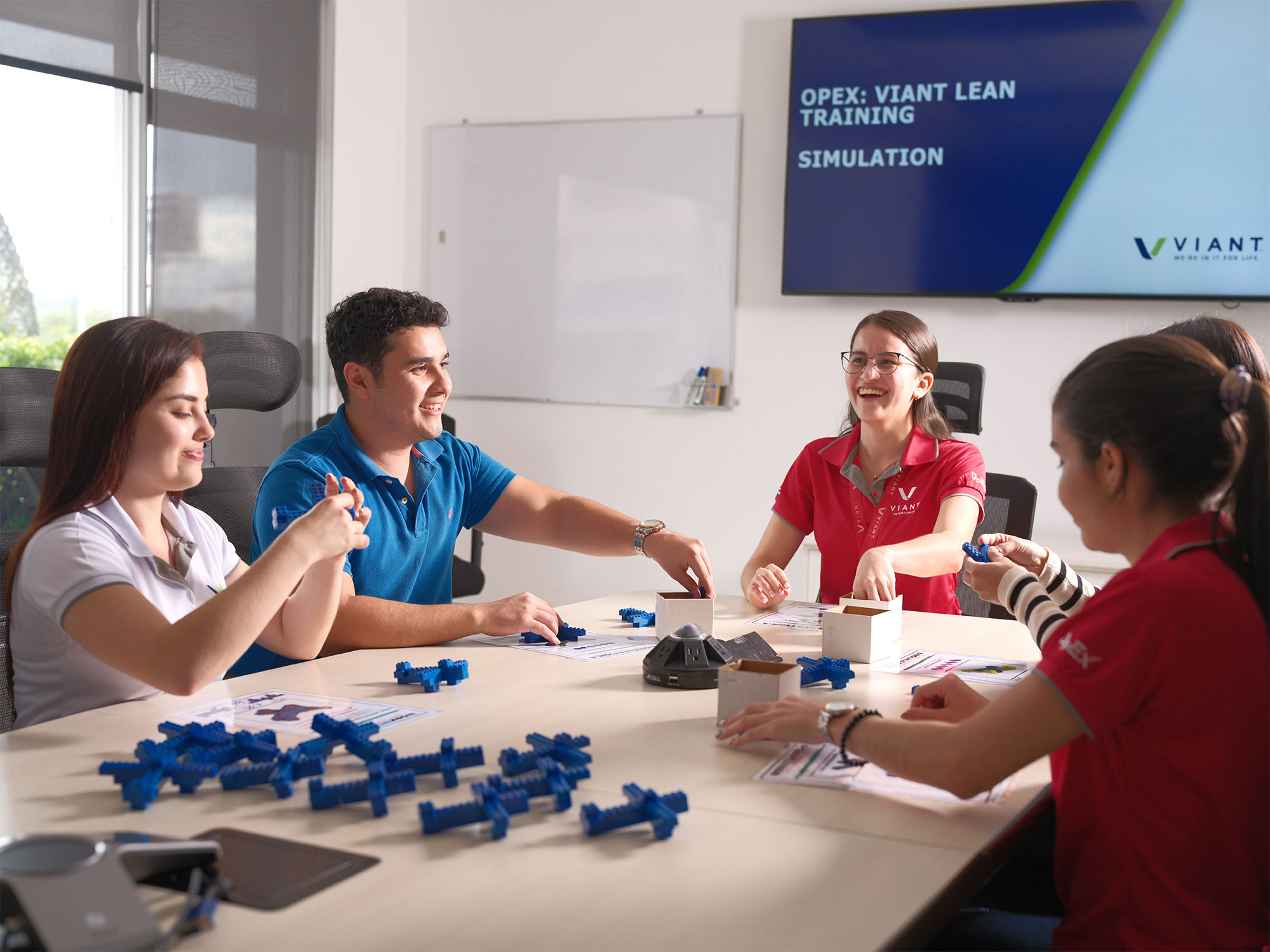 Viant team members sitting around a table in the conference room