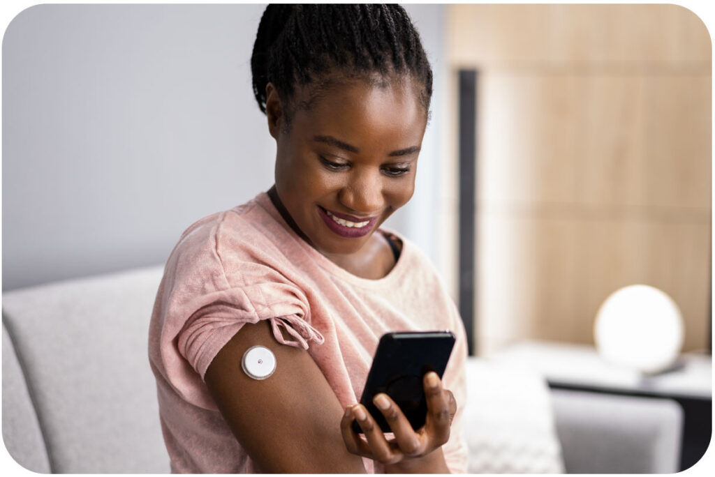 a woman holding and looking at her phone