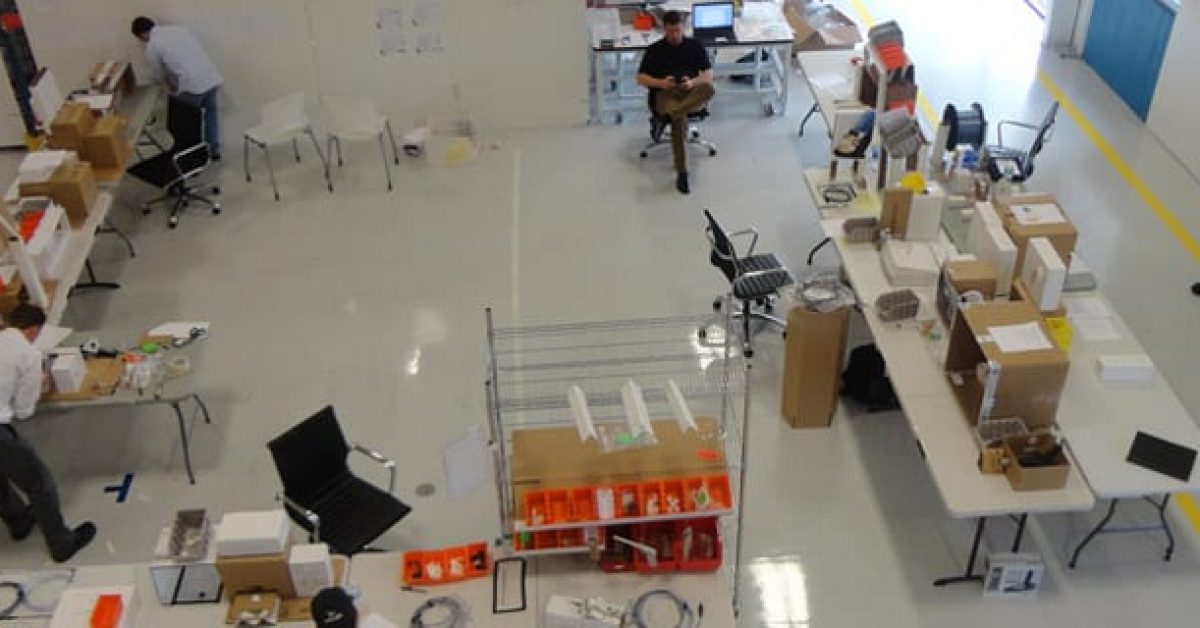 an overhead view of employees working together in a lab