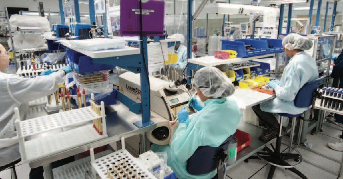 Viant employees at work stations on the manufacturing floor